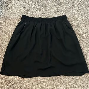 Black skirt from Massimo. Size L. Cute stud pocket detail